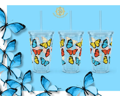 Set of four clear tumblers with butterfly designs on a blue background