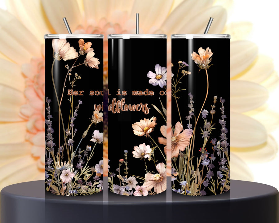 Three black floral tumblers with a quote on a blurred flower background