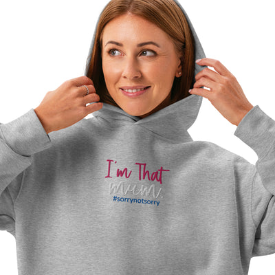 Woman wearing a gray hoodie with text 'I'm That Mum. #sorrynotsorry' design on a white background