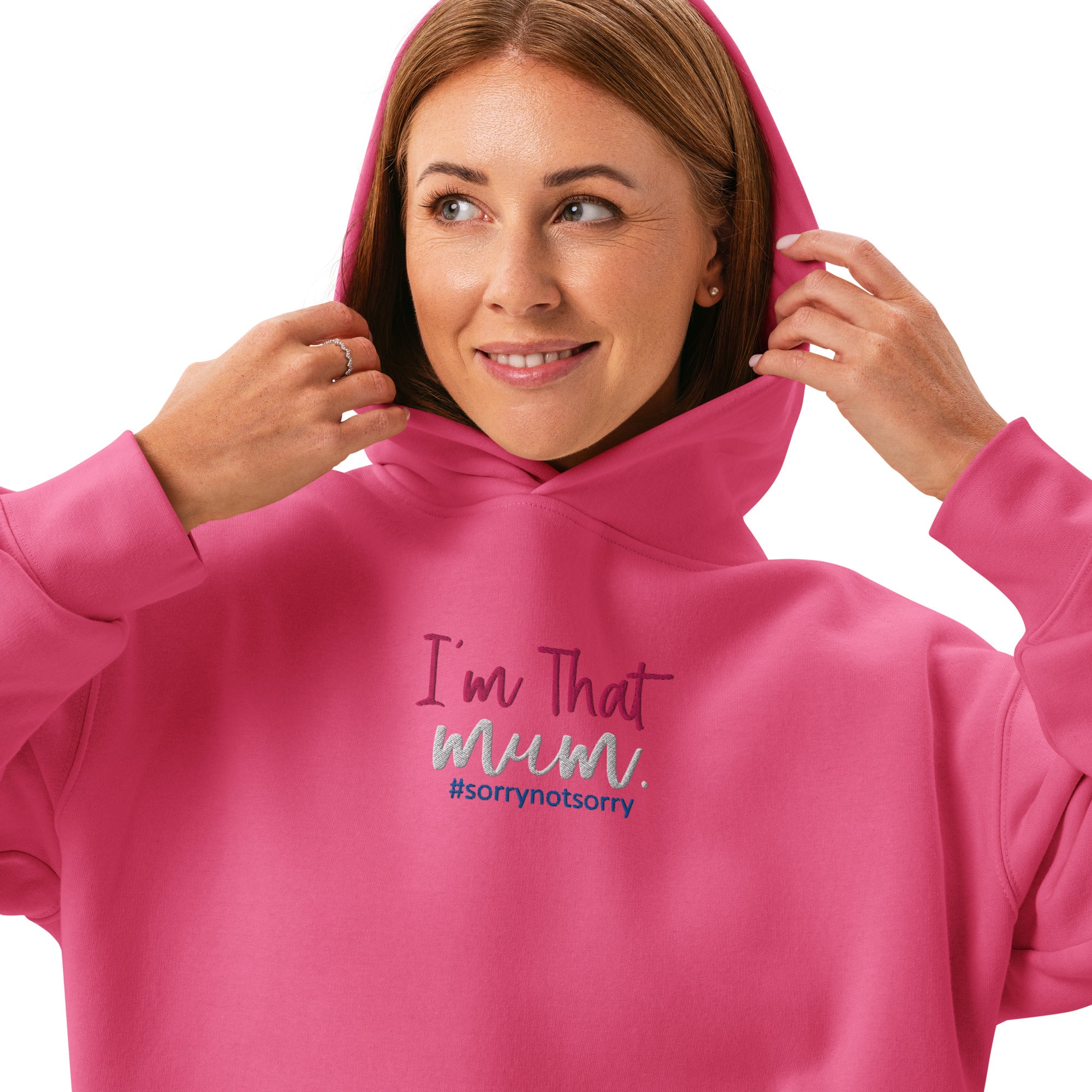Woman wearing a pink hoodie with text on a white background