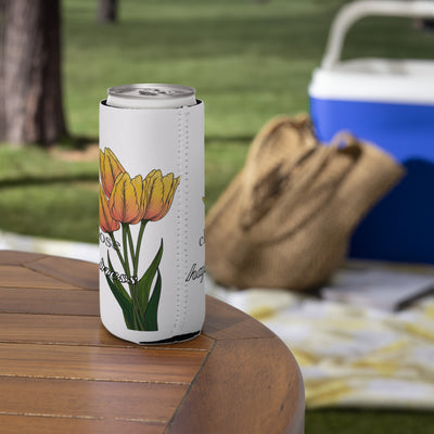 Can cooler with tulip design on a wooden table outdoors