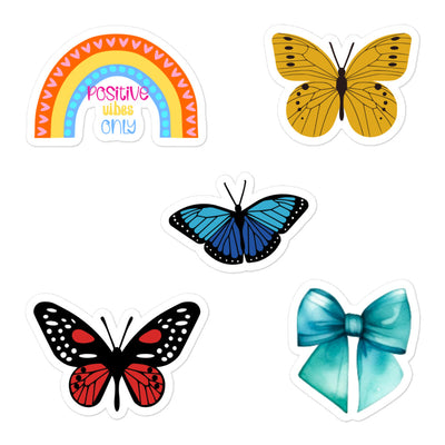 Kiss Cut rainbow, butterfly and bow stickers mock up with a white background.