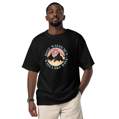 Man wearing a black t-shirt with a graphic design on a white background