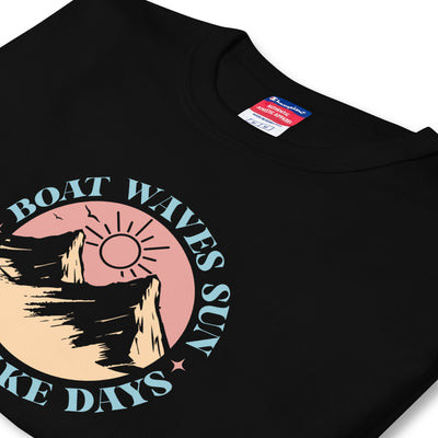 Black t-shirt with a graphic design featuring text and a sun, on a white background.