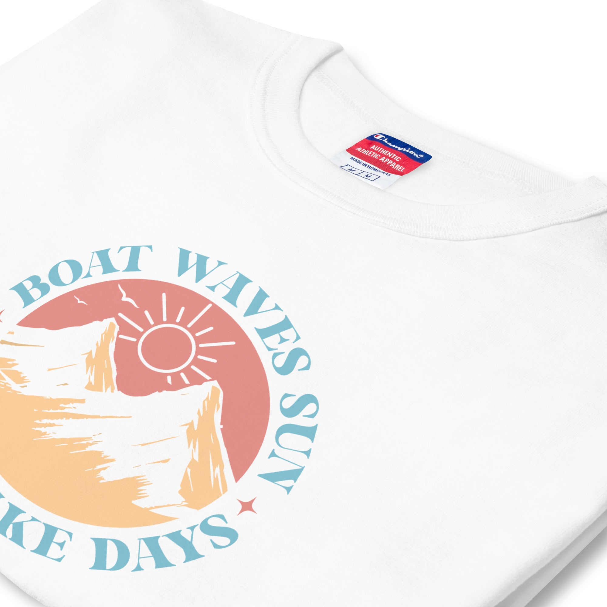 White t-shirt with a colourful graphic design featuring text and abstract elements on a white background.