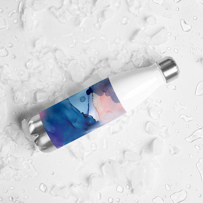 White cylindrical container with a colorful label on a textured white background