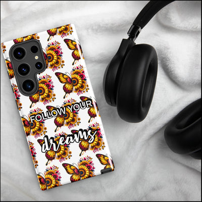 Phone case with butterfly design and 'Follow Your Dream' text on a marble surface