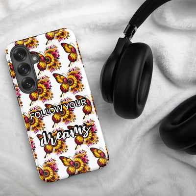 Phone case with butterfly design and 'Follow Your Dreams' text on a white background