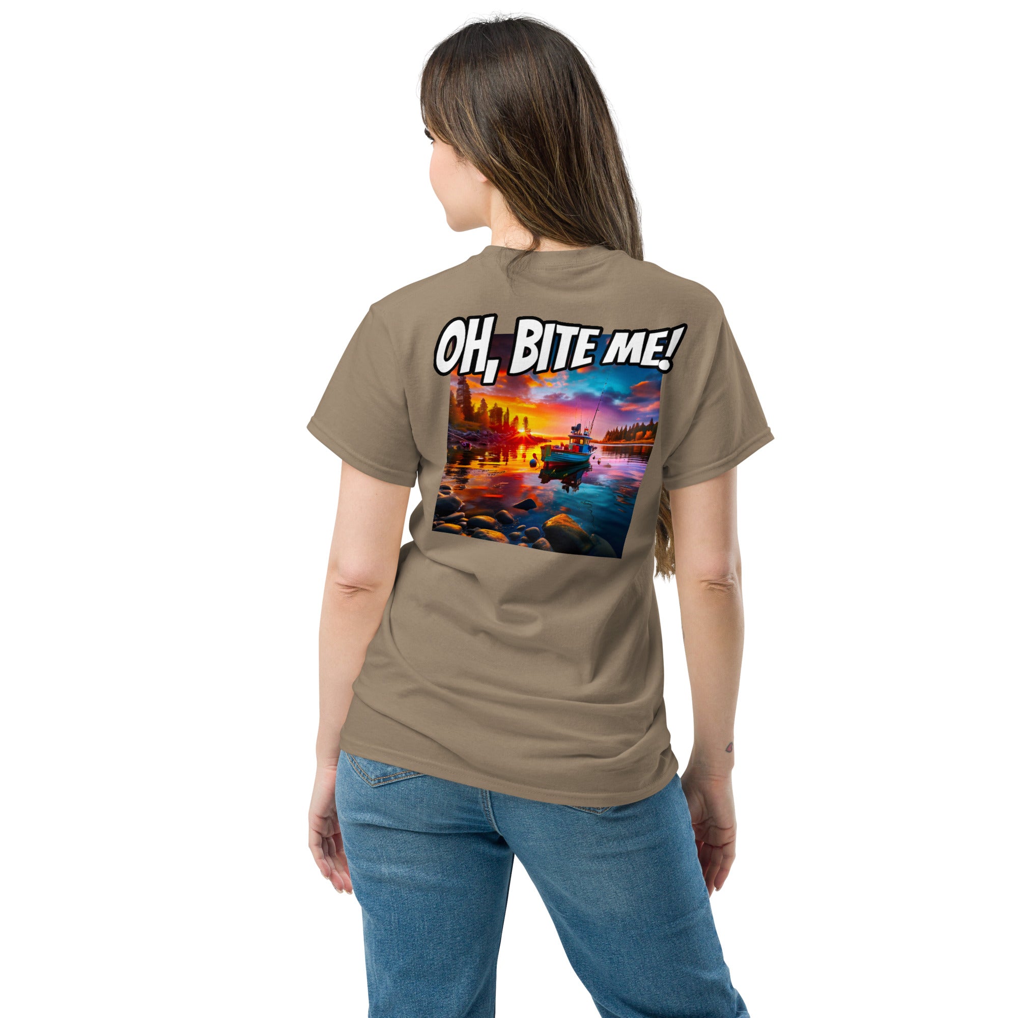 Woman wearing a brown t-shirt with a scenic design and 'OH, BITE ME!' text on the back.