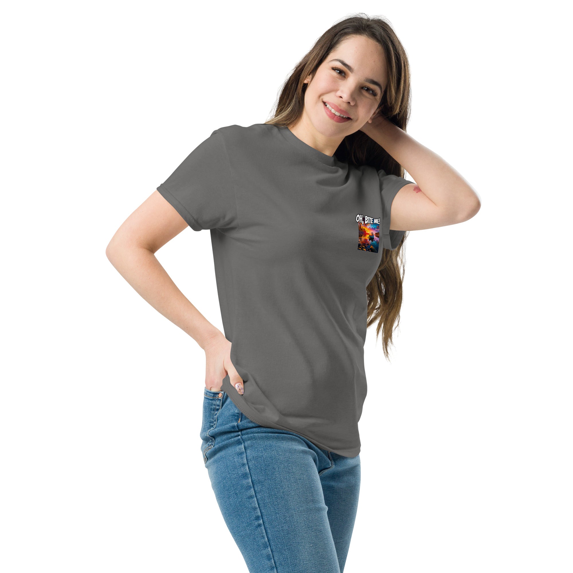 Woman wearing a grey t-shirt with a small graphic on a white background