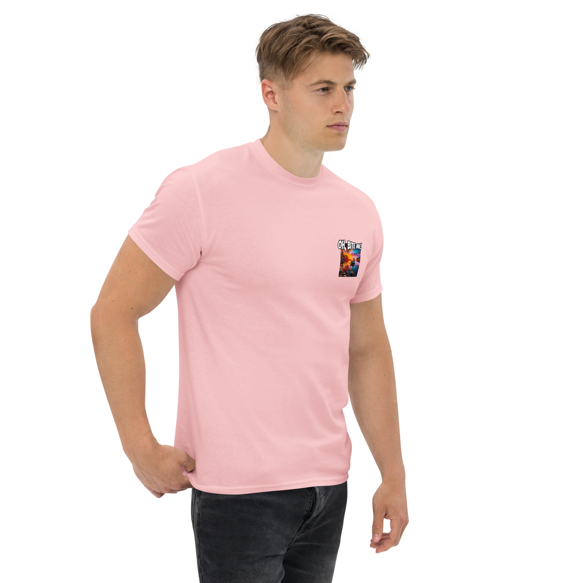 Man wearing a pink t-shirt with a small logo on the chest against a white background