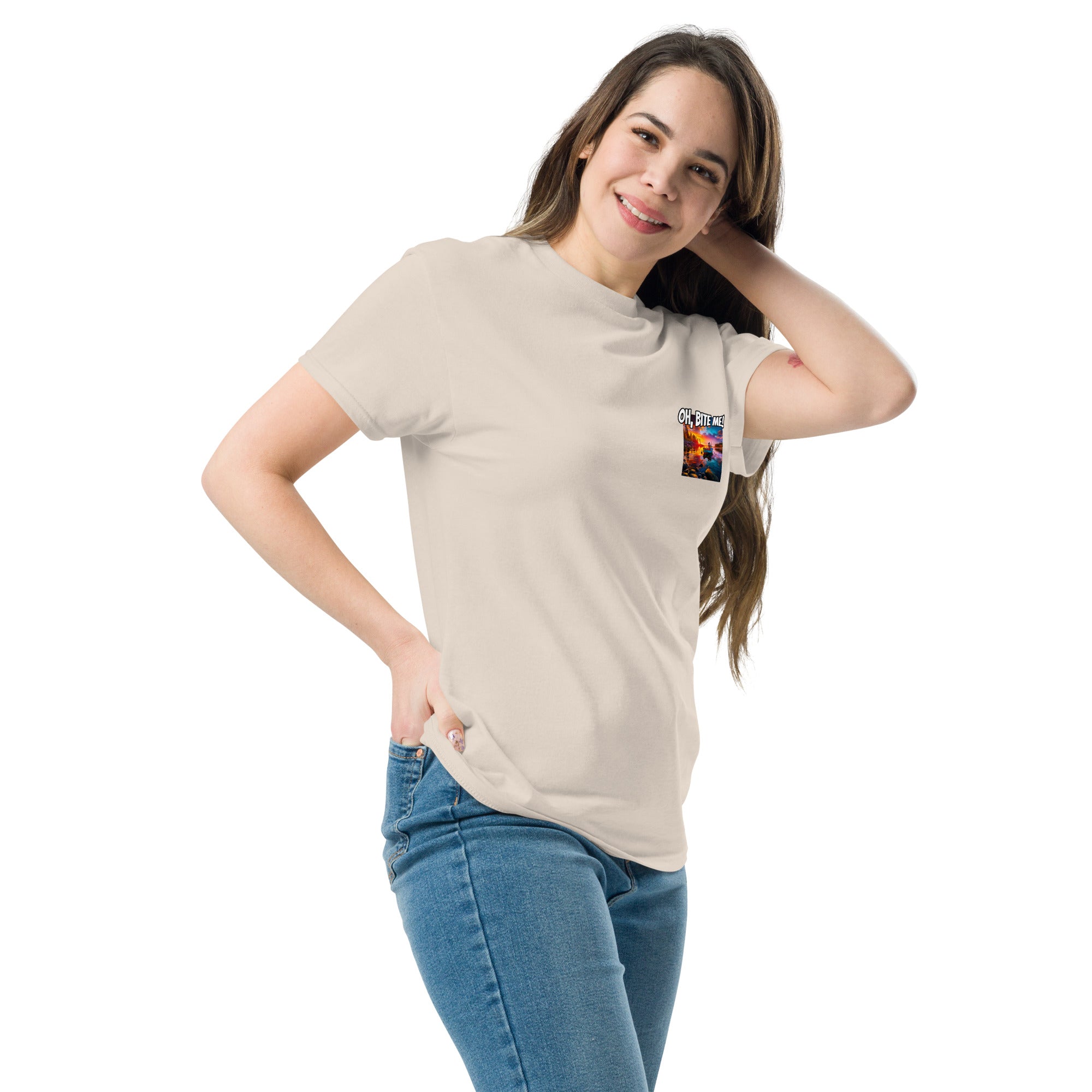 Woman wearing a beige t-shirt with a colourful graphic on a white background