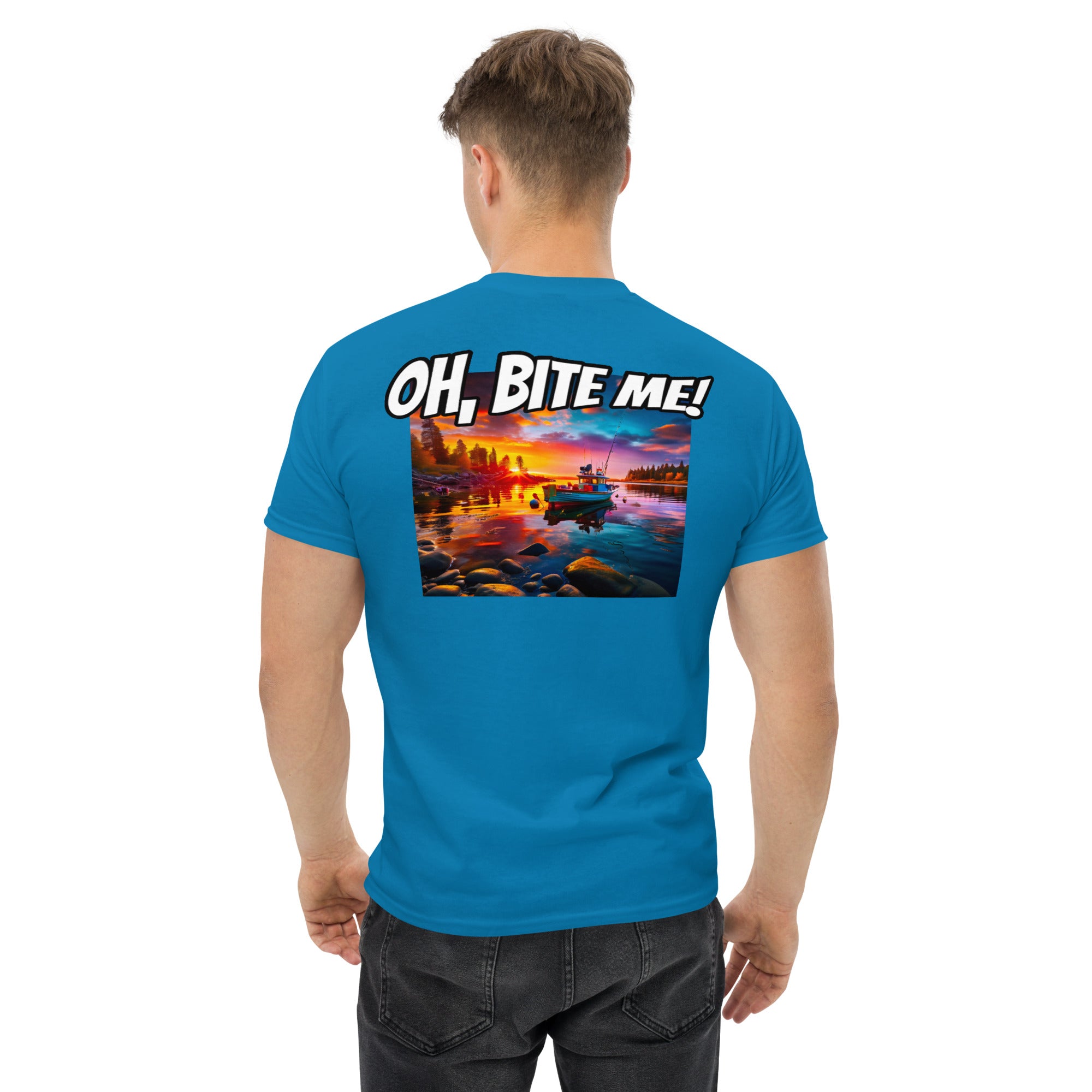 Man wearing a blue t-shirt with a sunset graphic and 'OH, BITE ME!' text on the back.