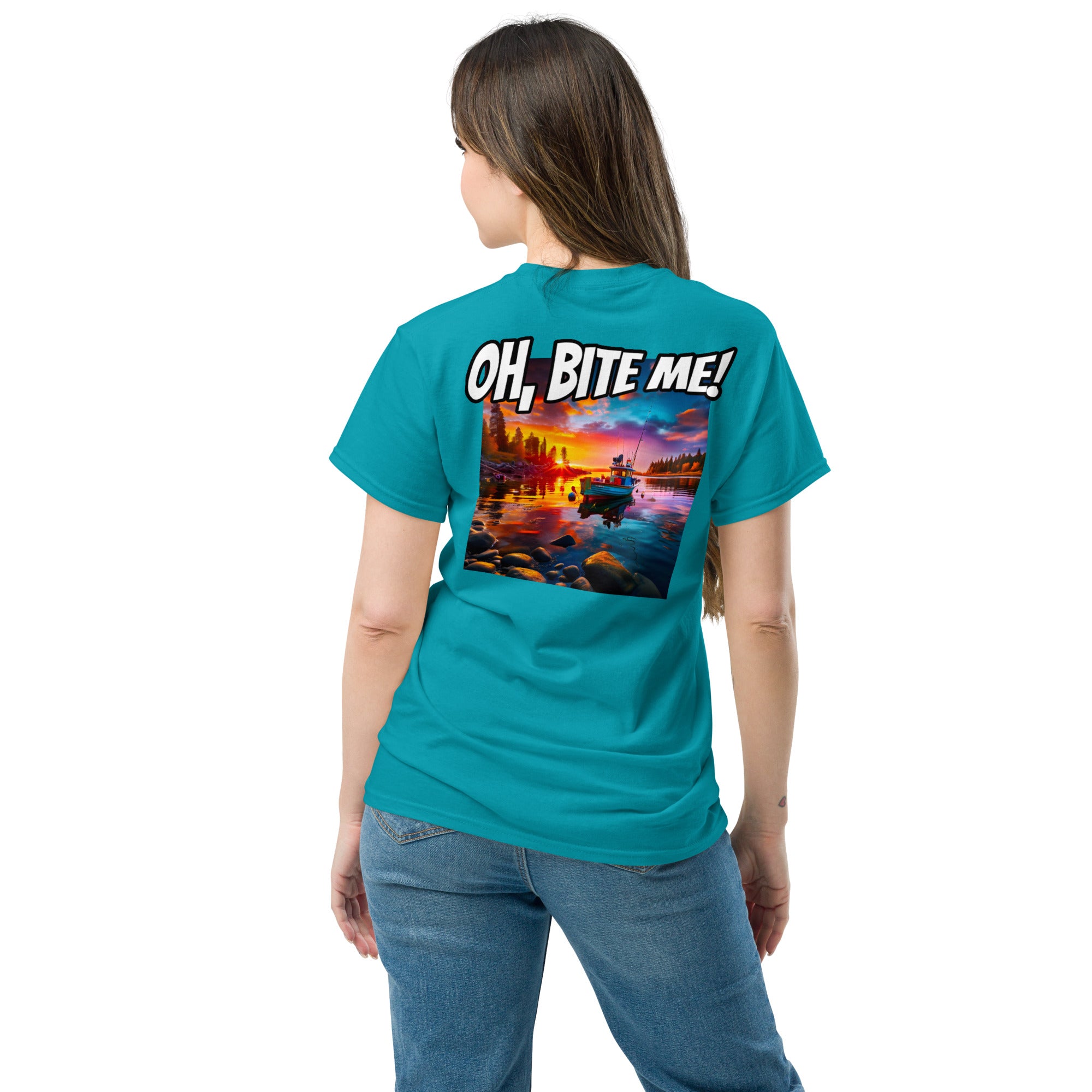Woman wearing a teal t-shirt with a colourful scenic design and text on the back