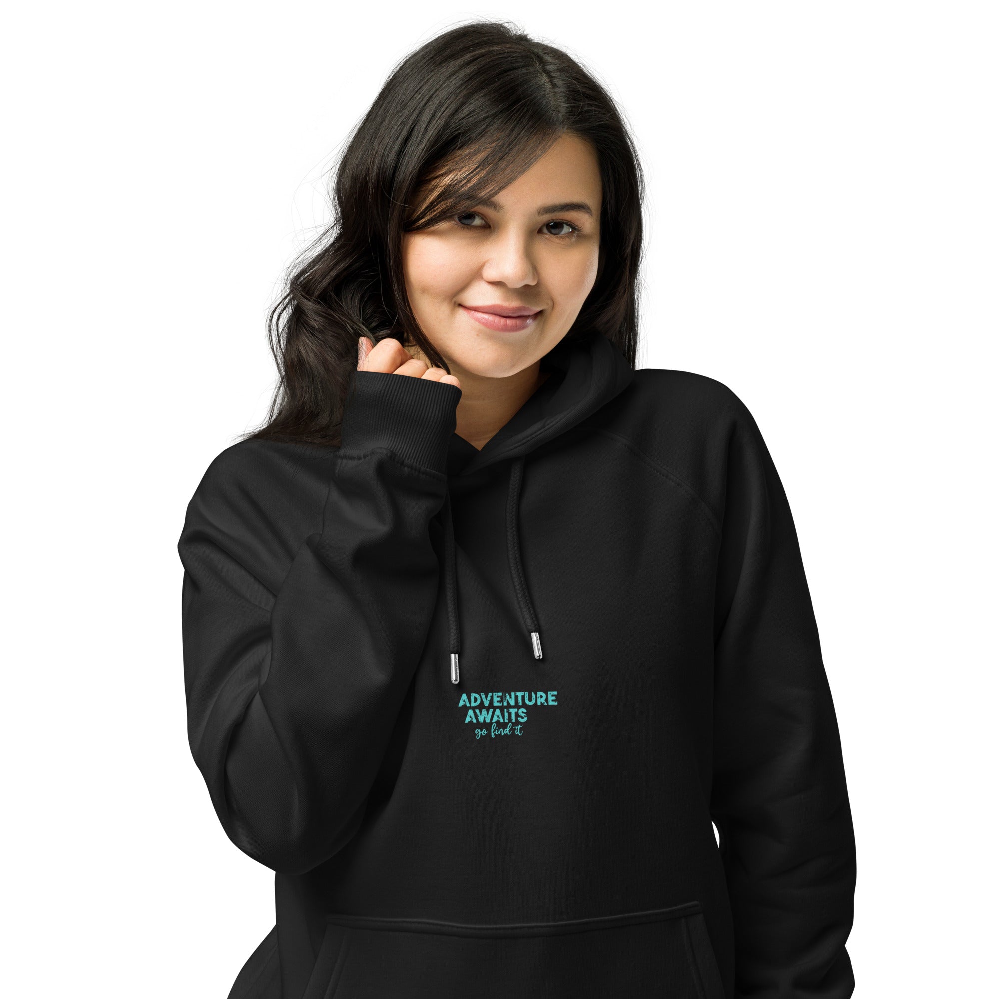 Person wearing a black hoodie with 'Adventure Awaits' text on a white background