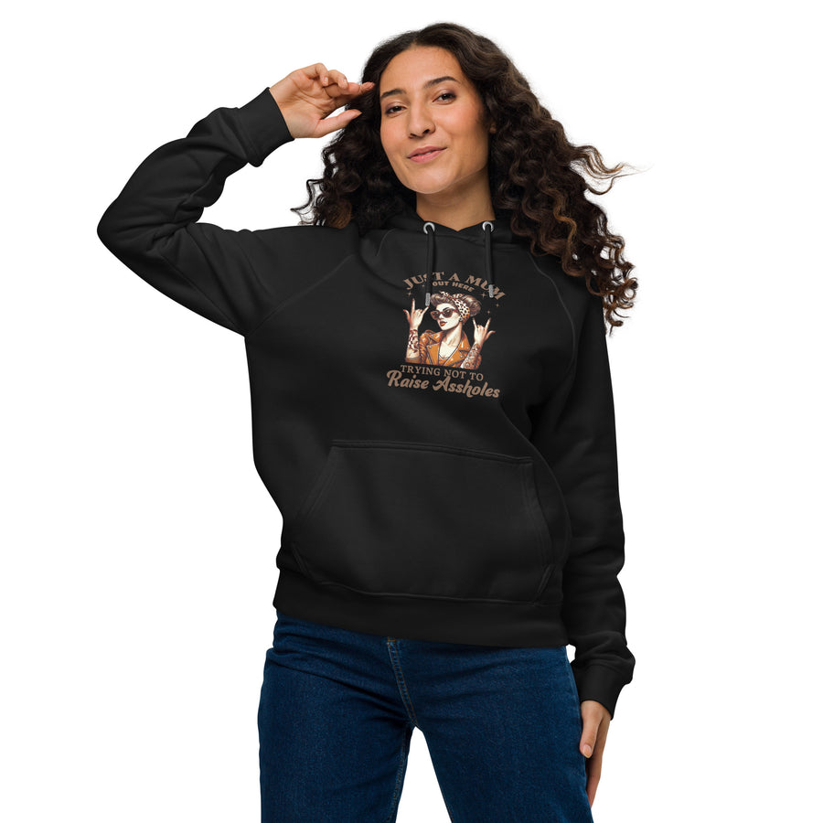 Woman wearing a black hoodie with a graphic design on a white background