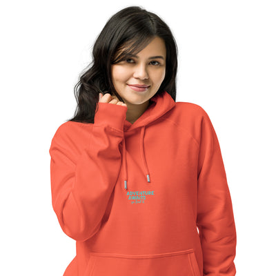 Person wearing an orange hoodie with text on a white background