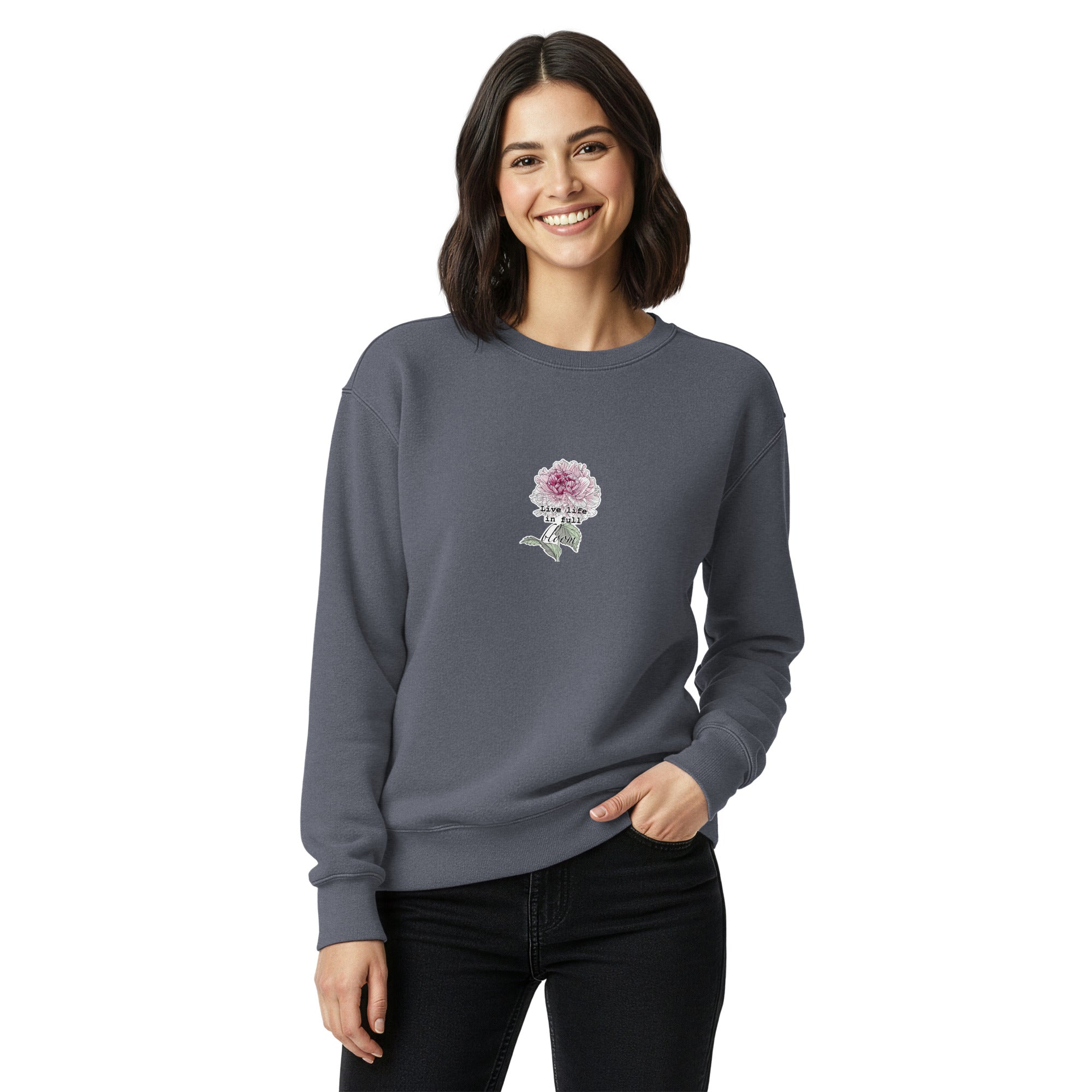 Woman wearing a gray sweatshirt with a floral design on a white background