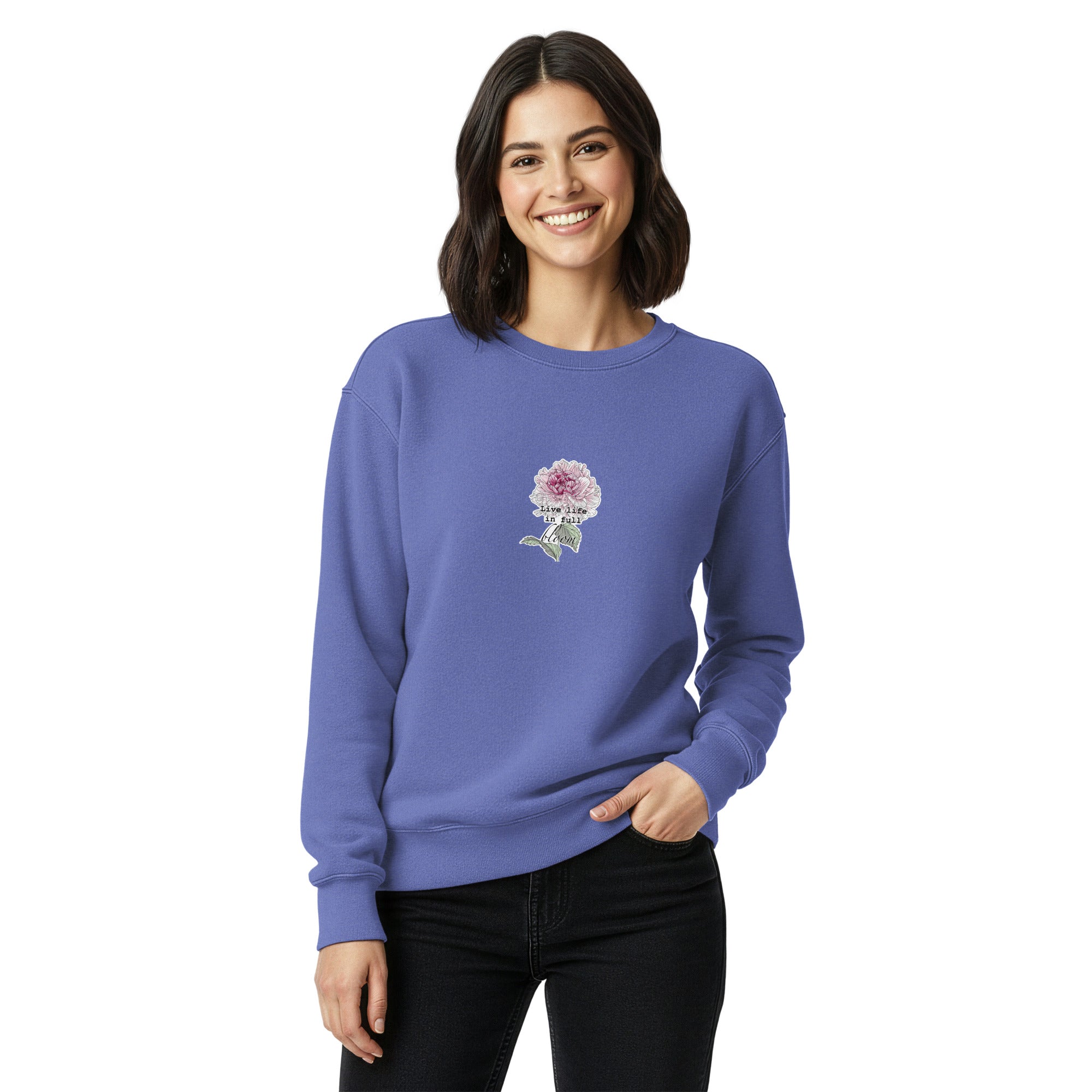 Woman wearing a blue sweatshirt with a floral design on a white background