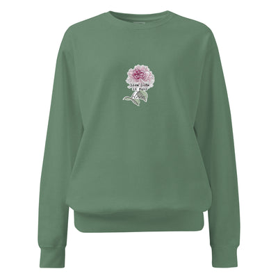 Green sweatshirt with a floral design and text on a white background
