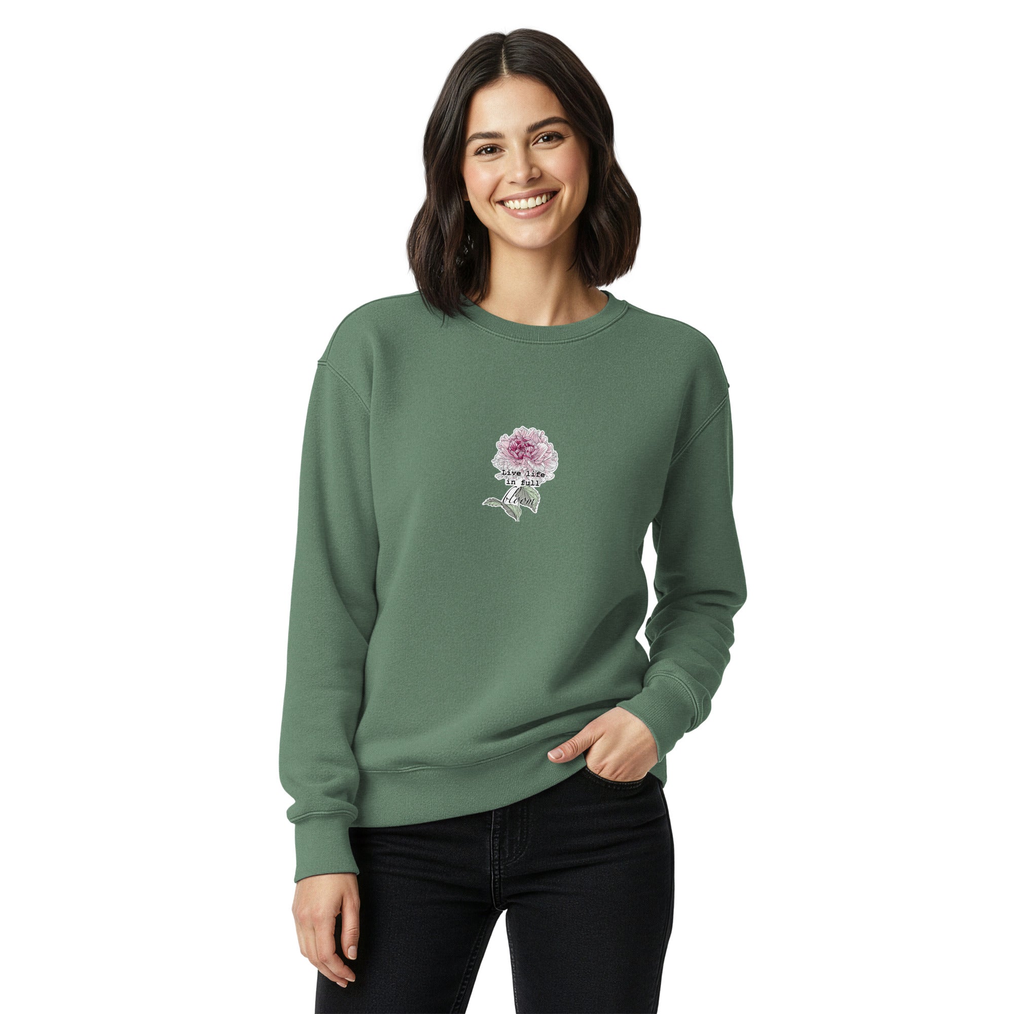 Woman wearing a green sweatshirt with a floral design on a white background