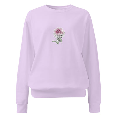 Lavender sweatshirt with floral design and text on a white background