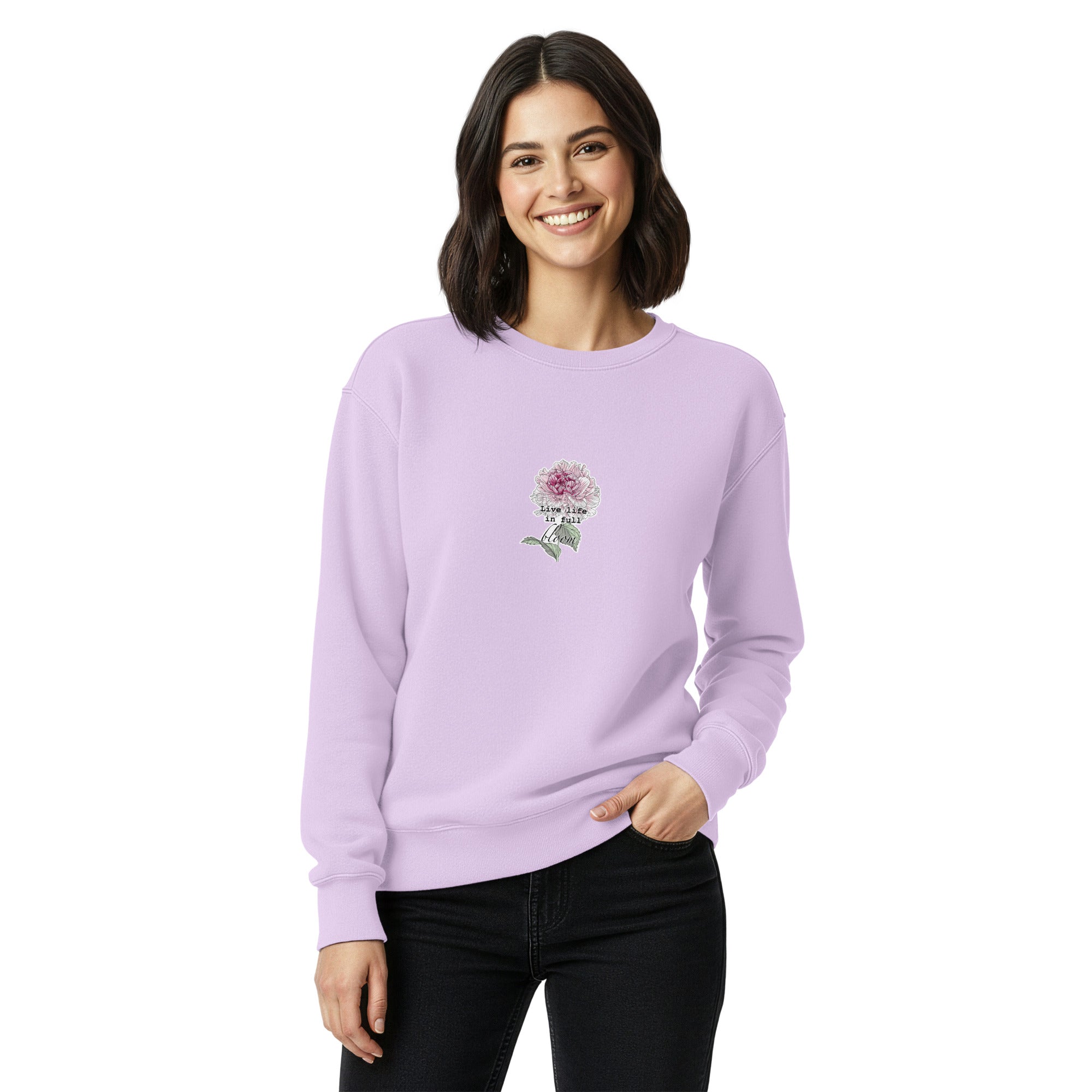 Woman wearing a light purple sweatshirt with a floral design on a white background