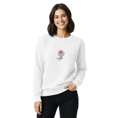 Woman wearing a white sweatshirt with a floral design on a white background