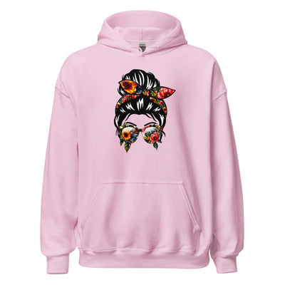 Pink hoodie with a colorful graphic of a woman's face on a white background