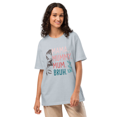 Woman wearing a light blue t-shirt with colourful text and graphics on a white background