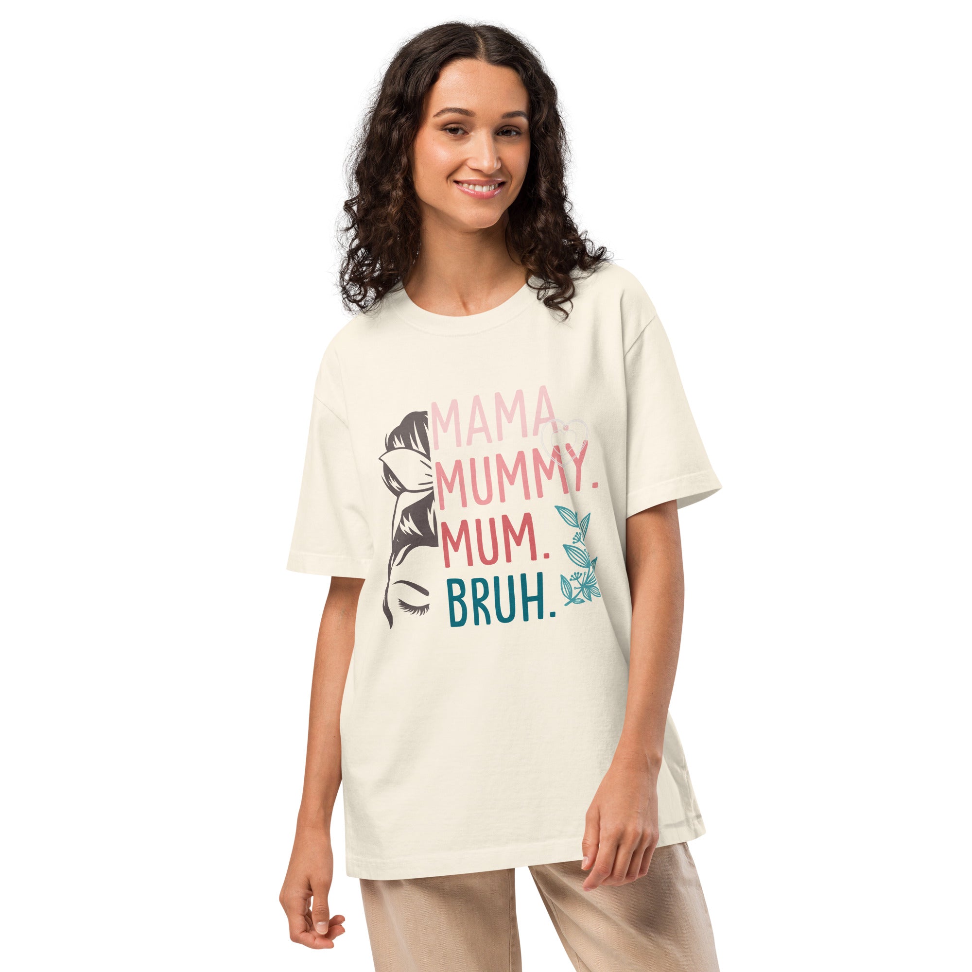 Woman wearing a cream t-shirt with colourful text and graphics on a white background