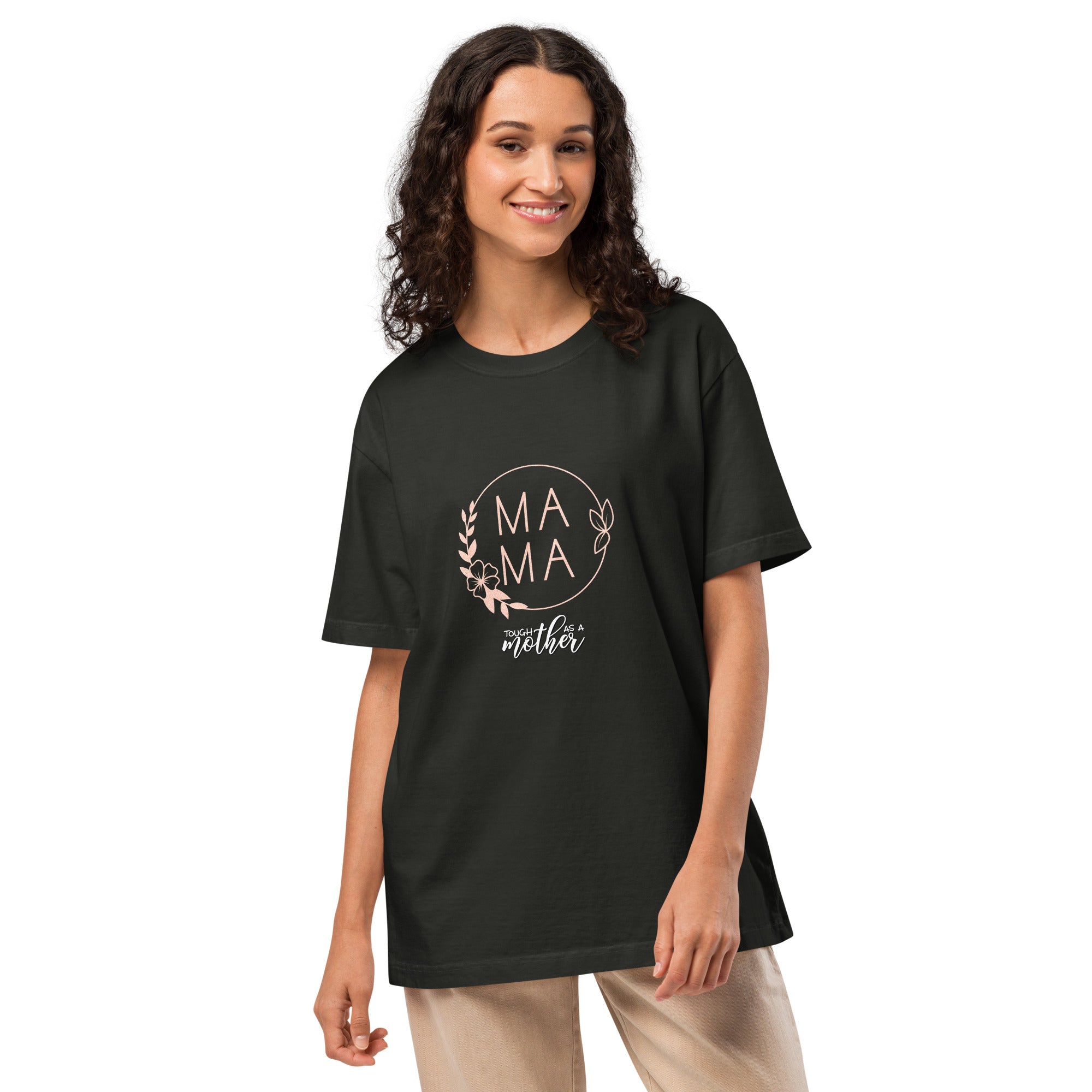 Woman wearing a black t-shirt with 'MAMA' text and floral design on a white background