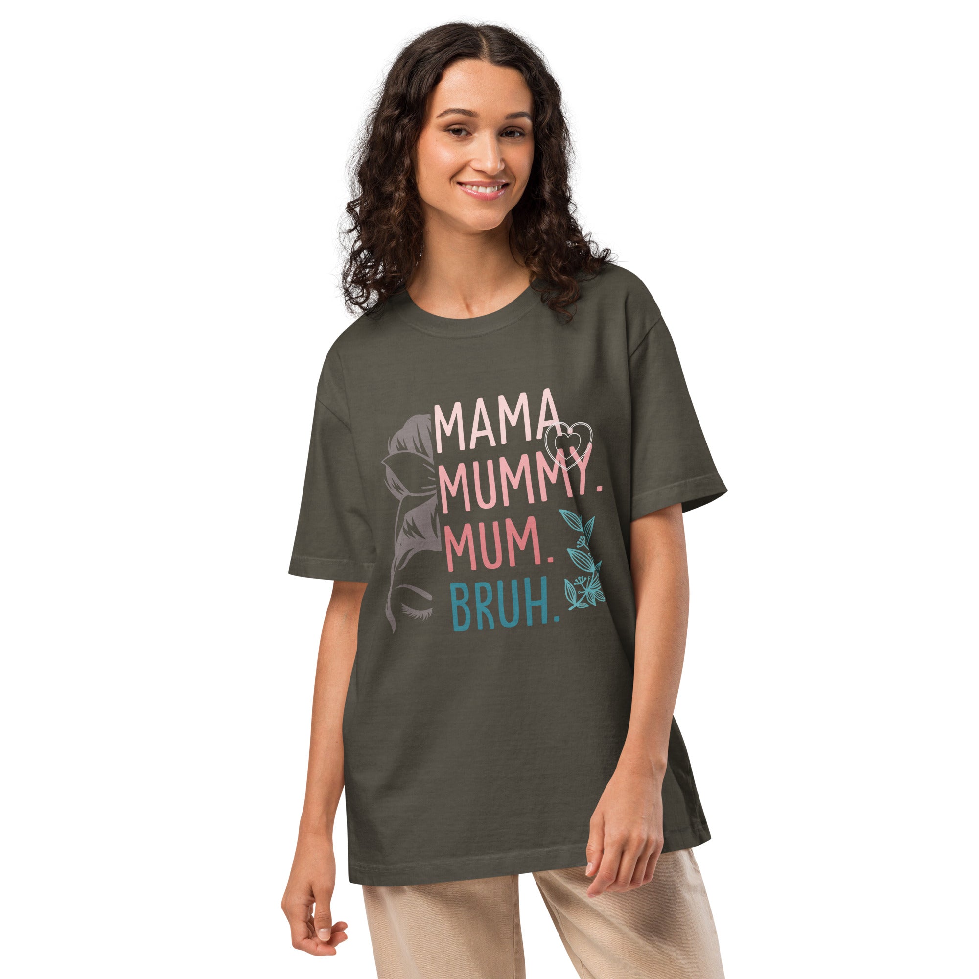 Woman wearing a dark green t-shirt with colourful text and graphics on a white background