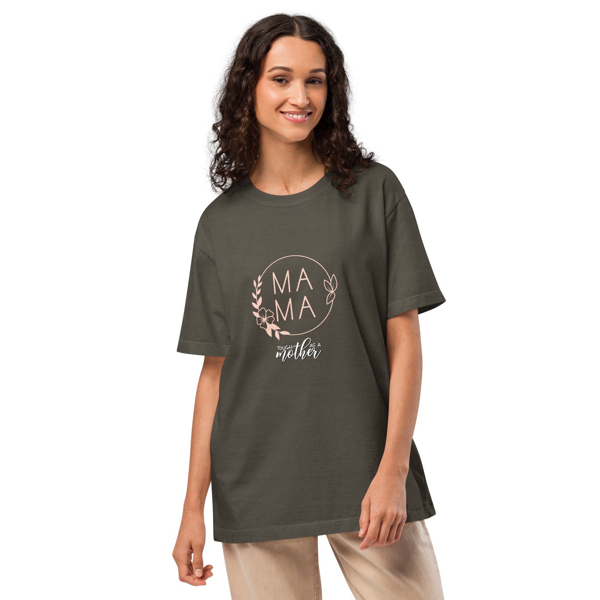 Woman wearing a green t-shirt with 'MAMA tough as a mother' text on a white background