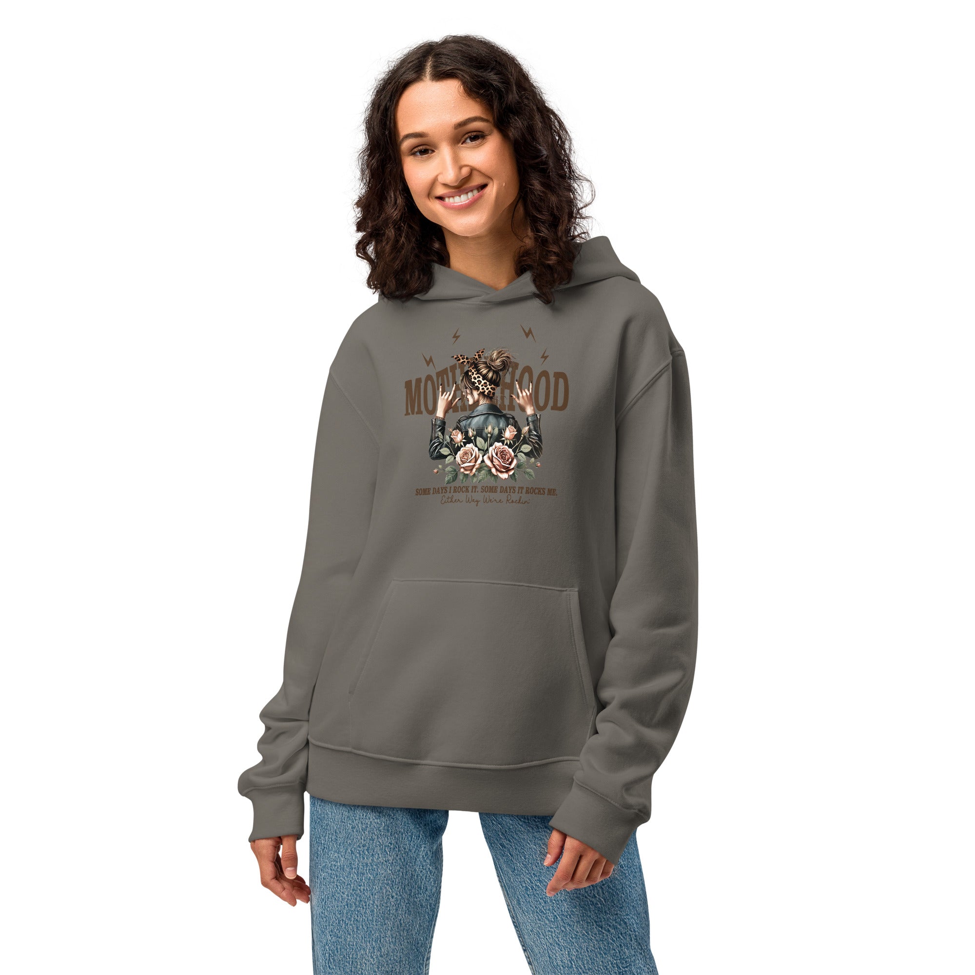 Woman wearing a gray hoodie with a graphic design on a white background