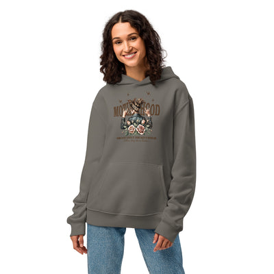 Woman wearing a gray hoodie with a graphic design on a white background