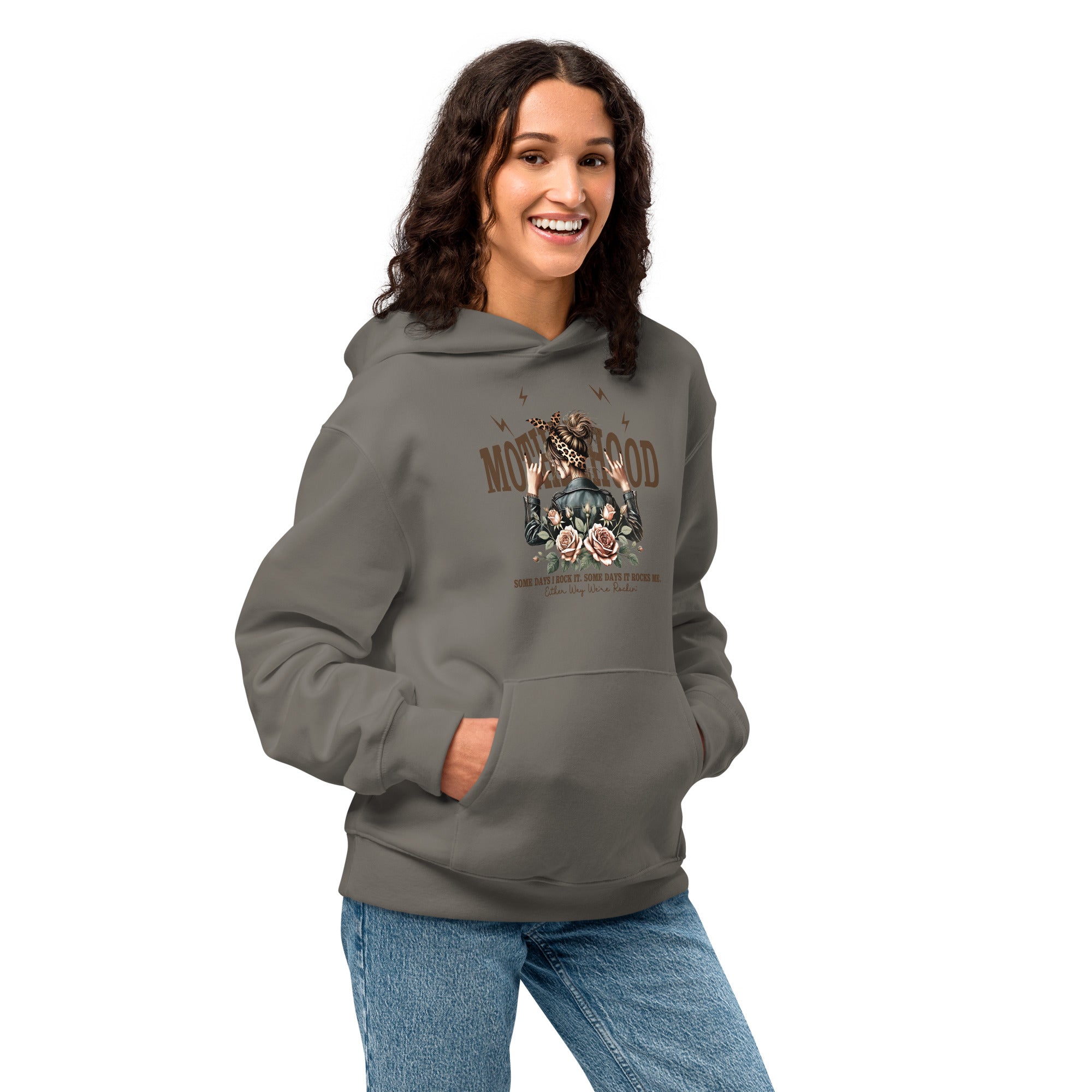Woman wearing a gray hoodie with a graphic design on a white background