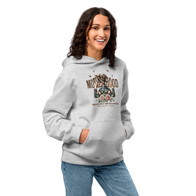 Woman wearing a gray hoodie with a graphic design on a white background