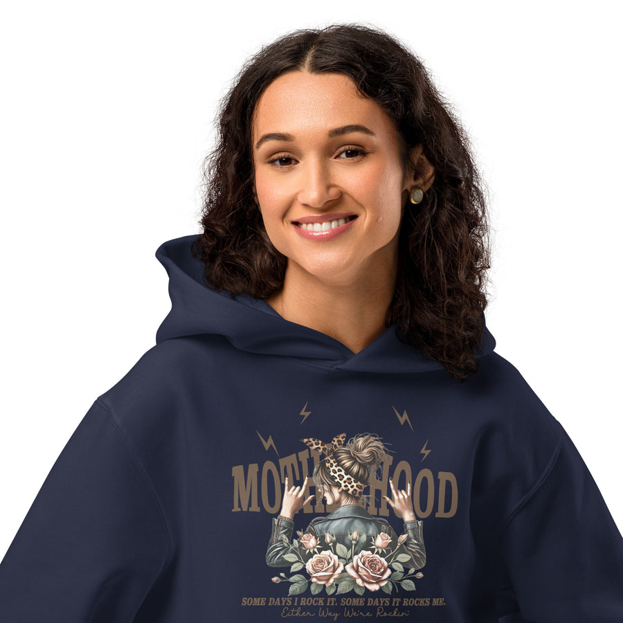 Person wearing a navy hoodie with a graphic design on a white background