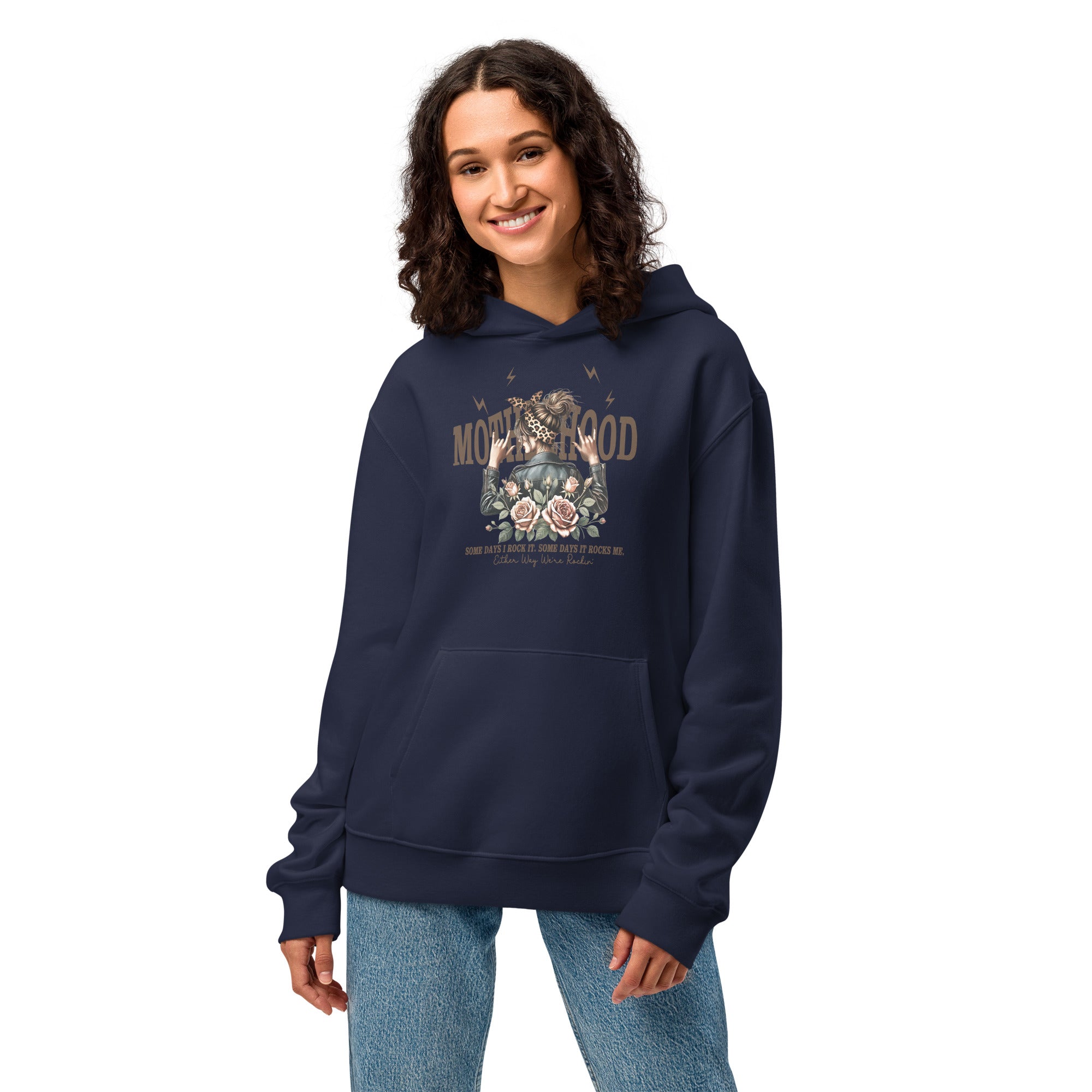 Woman wearing a navy blue hoodie with a graphic design on a white background