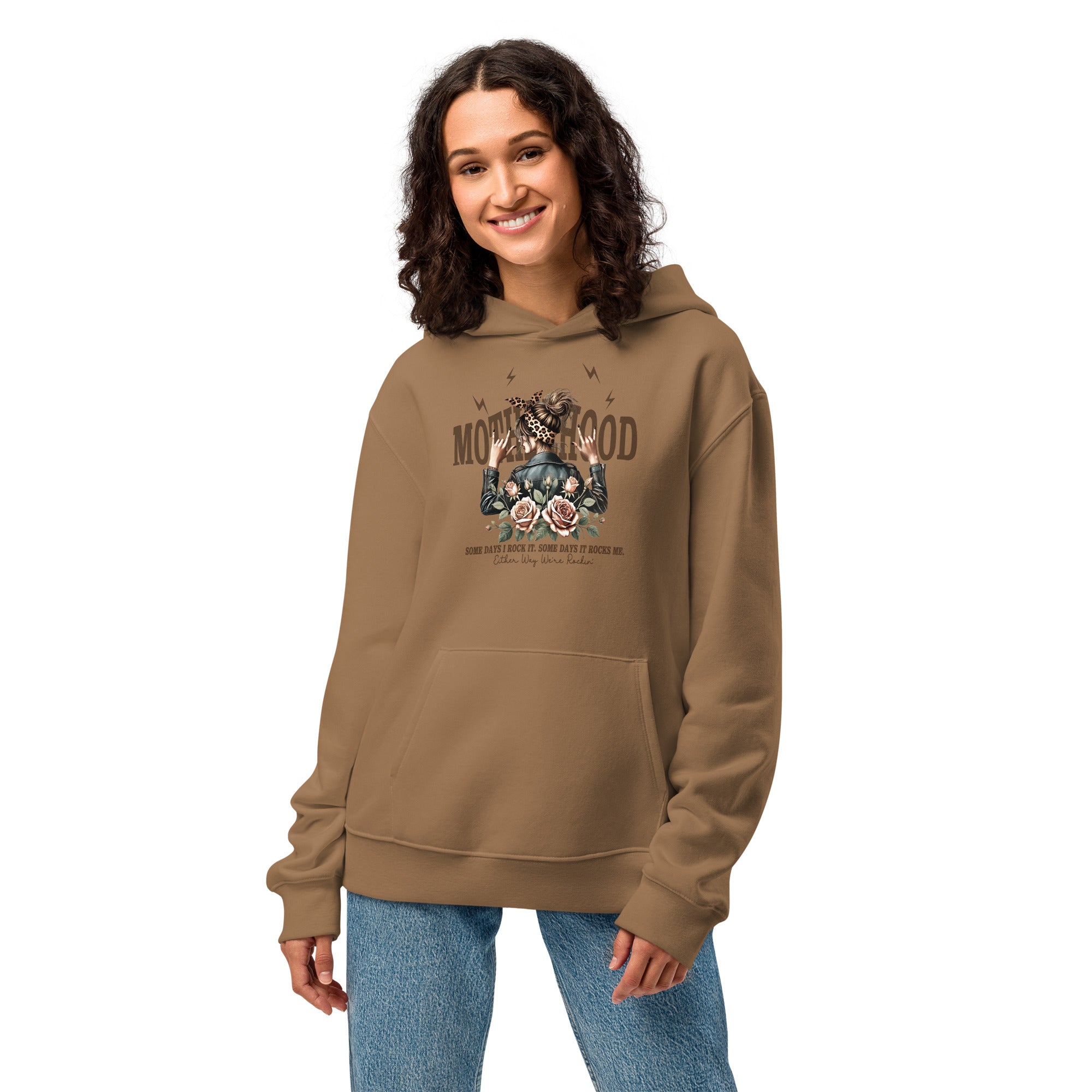 Woman wearing a brown hoodie with a graphic design on a white background