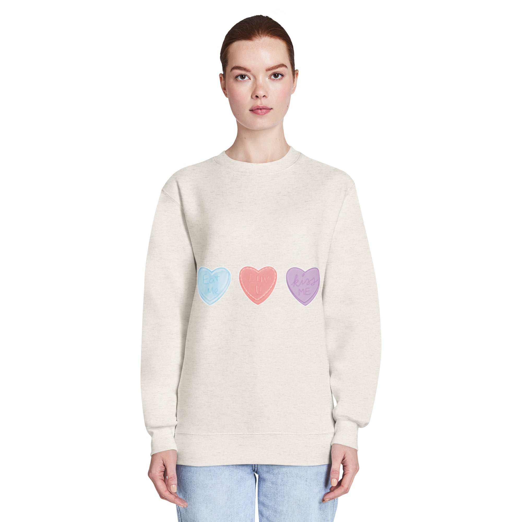 Person wearing a light coloured sweatshirt with colourful heart designs on a white background