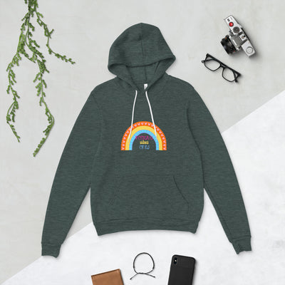 Green hoodie with rainbow design on a light grey background