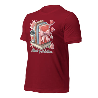 Red t-shirt with Valentine's Day design featuring books, a coffee cup, and a bow on a white background.