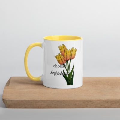 Mug with yellow tulips and 'choose happiness' text on a wooden surface