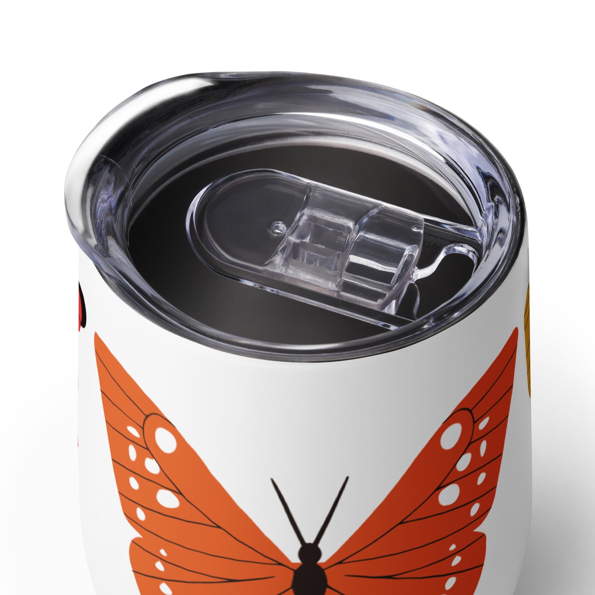 White tumbler with orange butterfly design on a white background