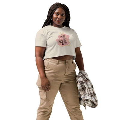 Woman wearing a bone coloured t-shirt with a motivational quote text design and beige pants on a white background