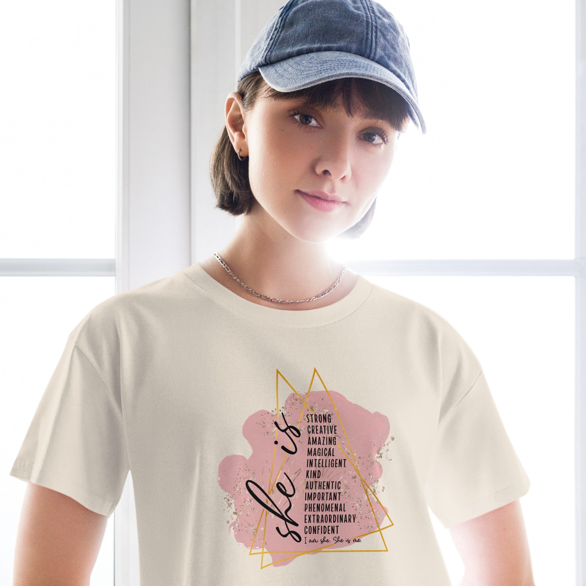 Person wearing a bone coloured t-shirt with a motivational quote design.