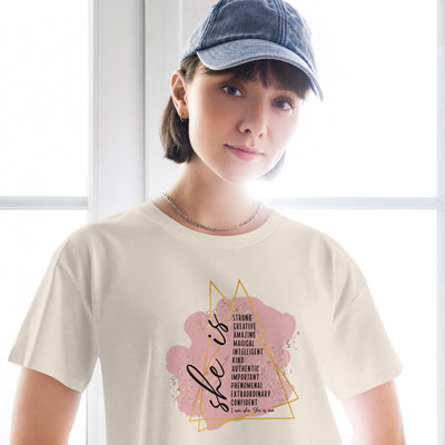 Person wearing a bone coloured t-shirt with a motivational quote design.