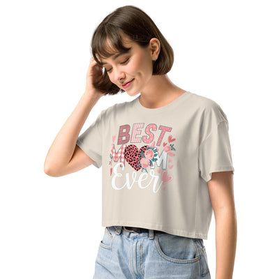 Woman wearing a beige t-shirt with 'Best Mum Ever' text and floral design on a white background